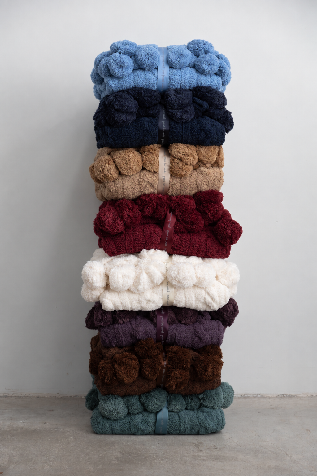Pom Pom Cable Knit Blanket